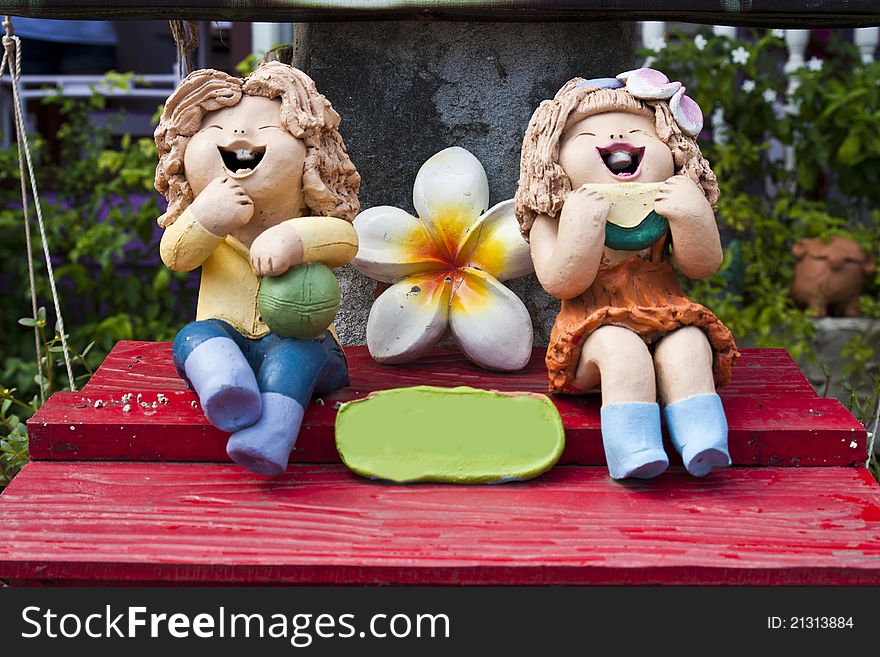 Bright colour pottery happy smile cartoon dolls. Bright colour pottery happy smile cartoon dolls