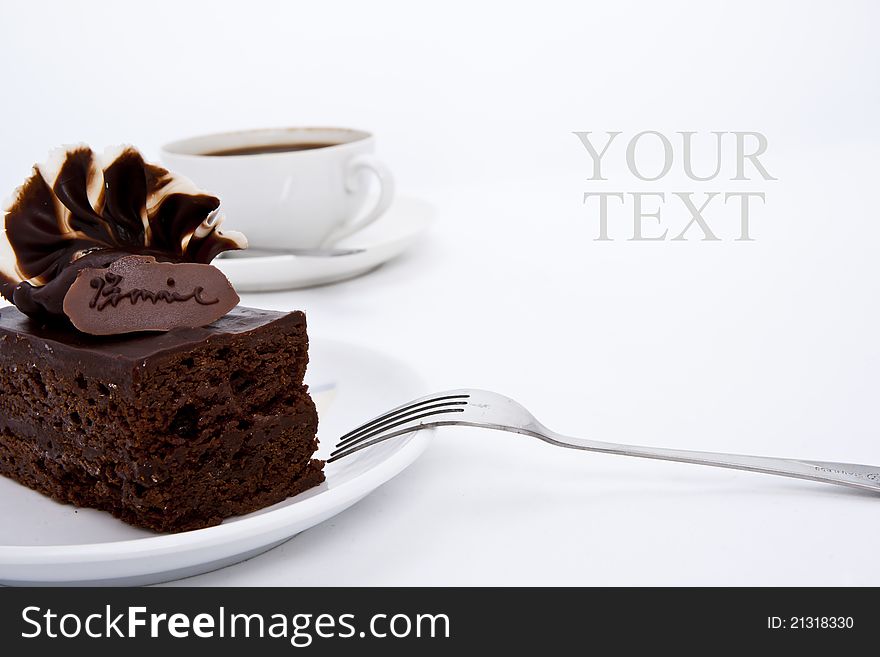 Delicious brownie cake with luxury cream topping and coffee