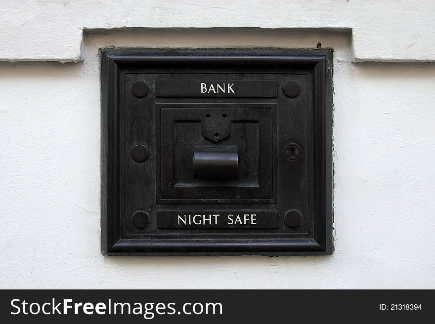 Closeup of an old style bank night deposit. Closeup of an old style bank night deposit