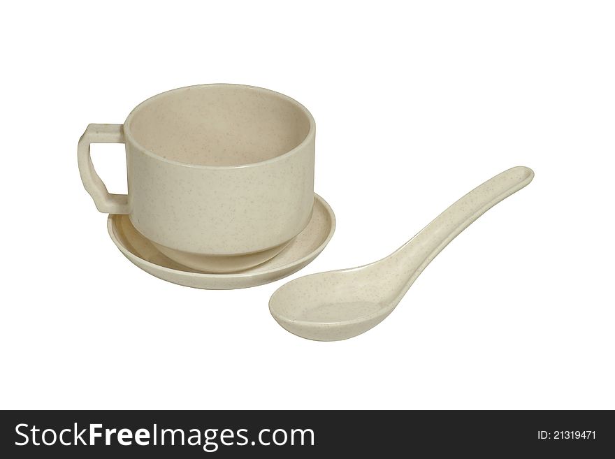 Melamin cup, saucer and spoon isolated on white