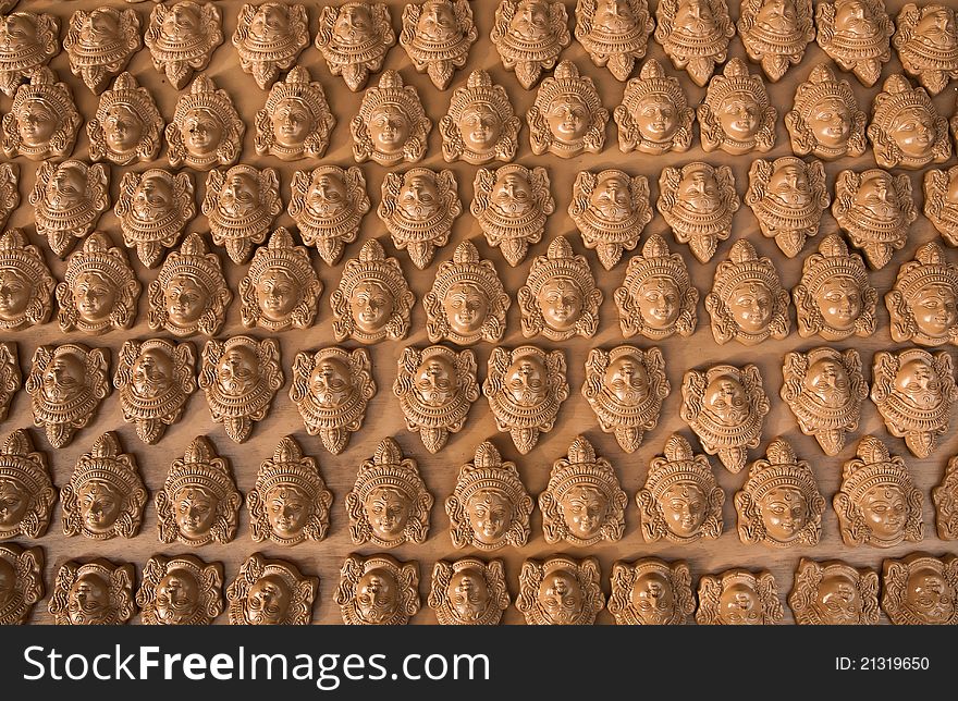 Many clay heads of Goddess Durga arranged for sale for the Dussera festival of Hindu religion. Many clay heads of Goddess Durga arranged for sale for the Dussera festival of Hindu religion