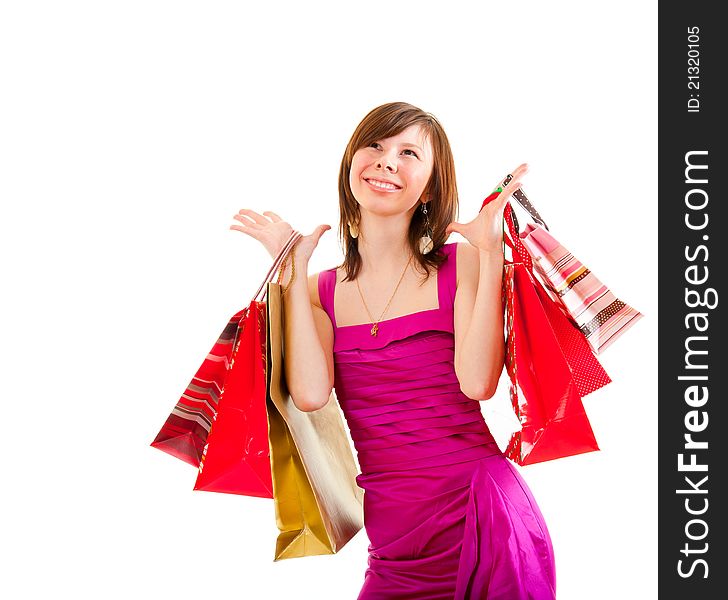 Happy girl after successful shopping with bags in her hands looking up