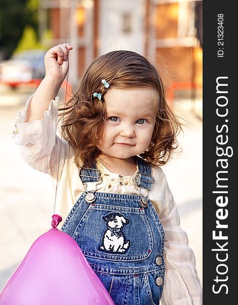 Baby girl happy portrait with balloon