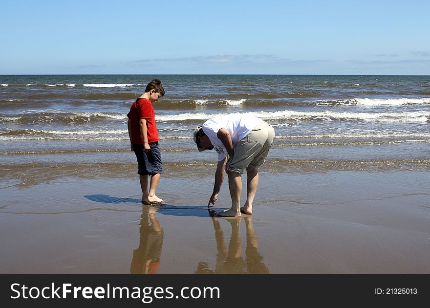 Father and son on beach