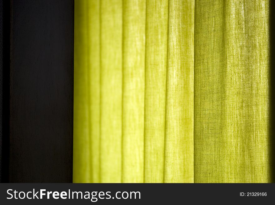 Green curtain with natural window light background image. Green curtain with natural window light background image