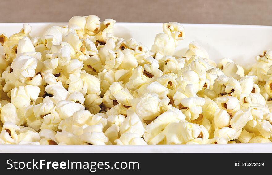 Freshly popped pop corn in a bowl ready to eat.