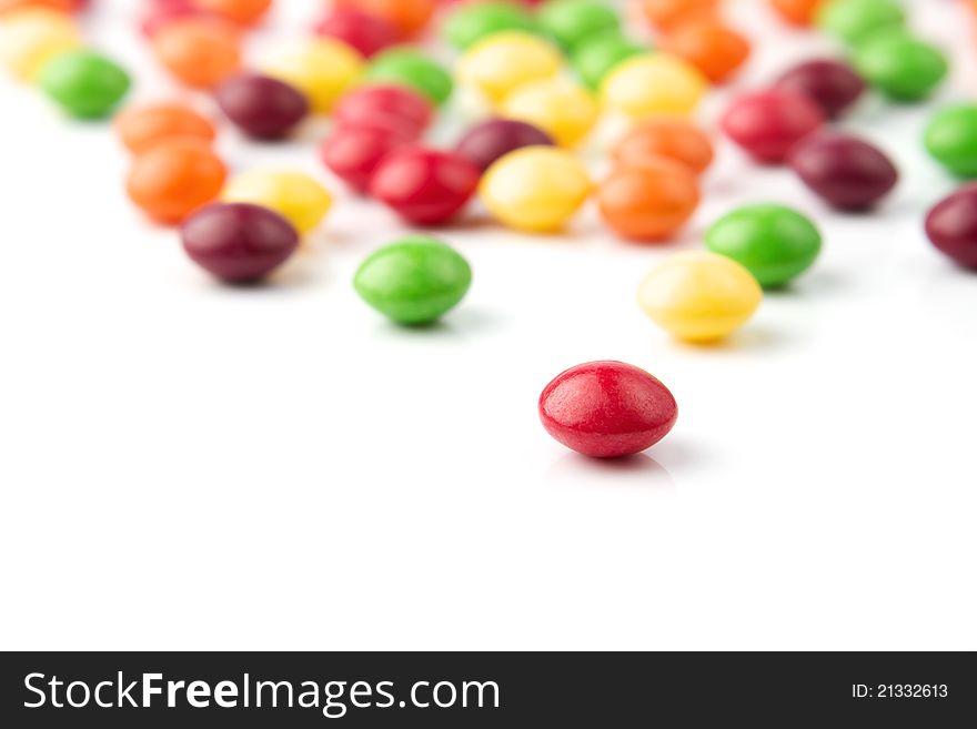 Colorful fruit candies on white background