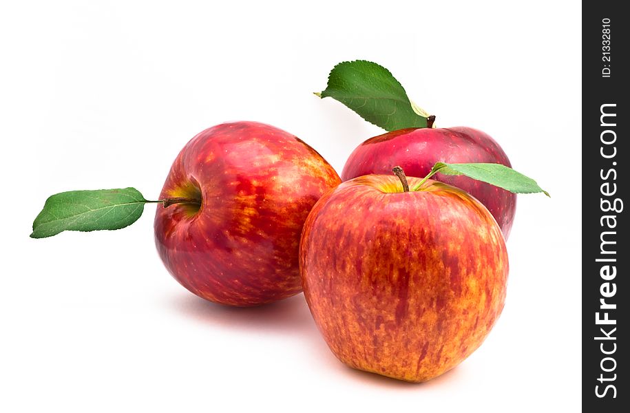 Red Apples with leaf on white background