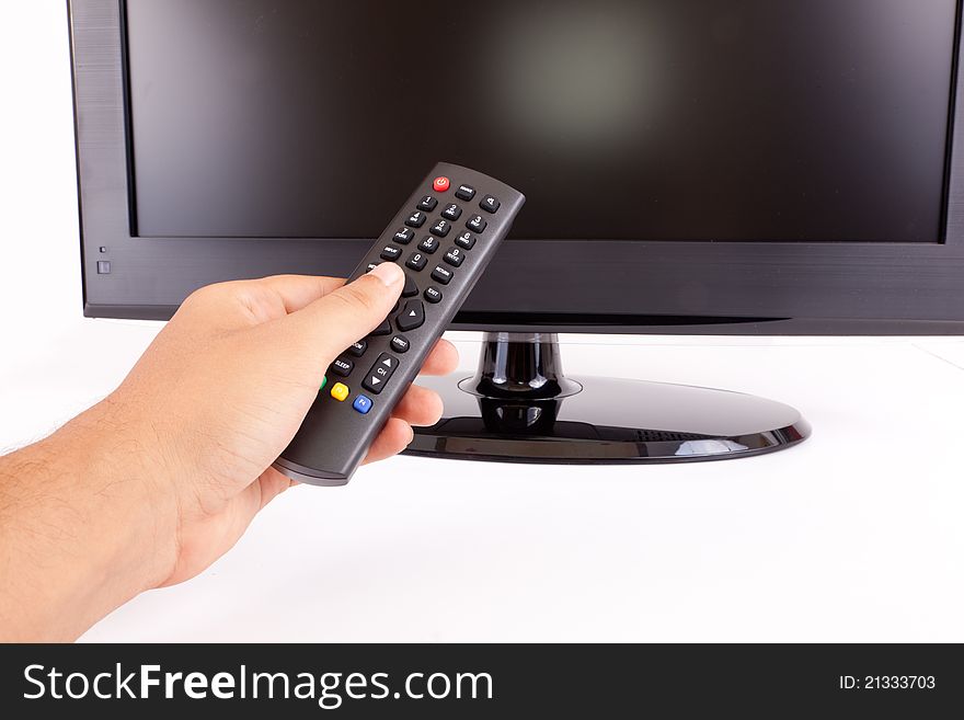 Widescreen black LCD TV isolated on white Remote. Widescreen black LCD TV isolated on white Remote