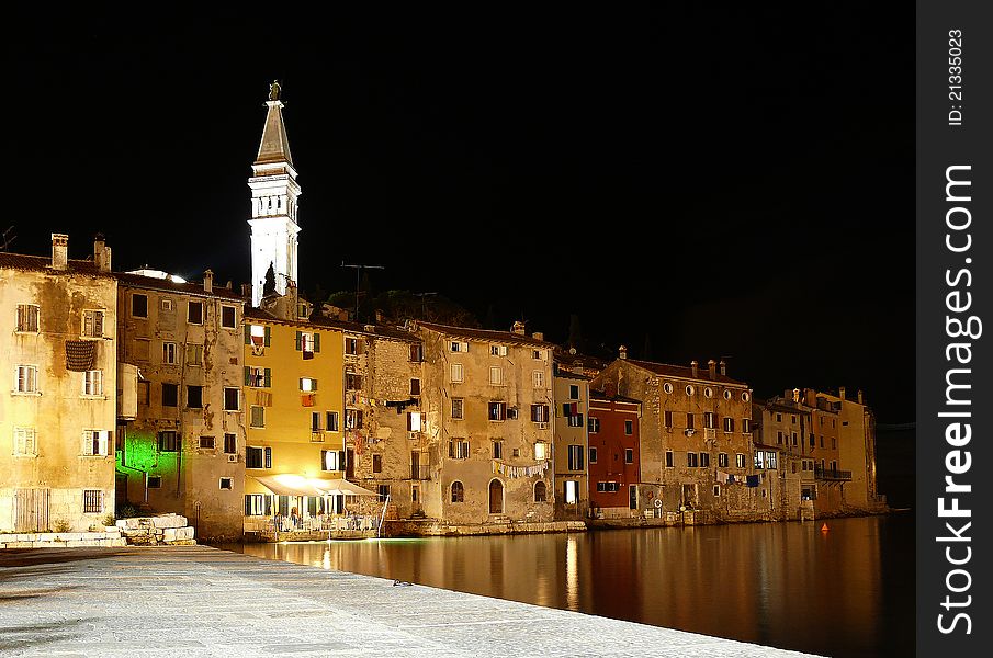 Night scene: a kind on Rovinj bay from landing stage. A cathedral of St. Evfimii. Night scene: a kind on Rovinj bay from landing stage. A cathedral of St. Evfimii.