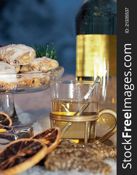 White glow-wine with cookies and winter-decoration. White glow-wine with cookies and winter-decoration