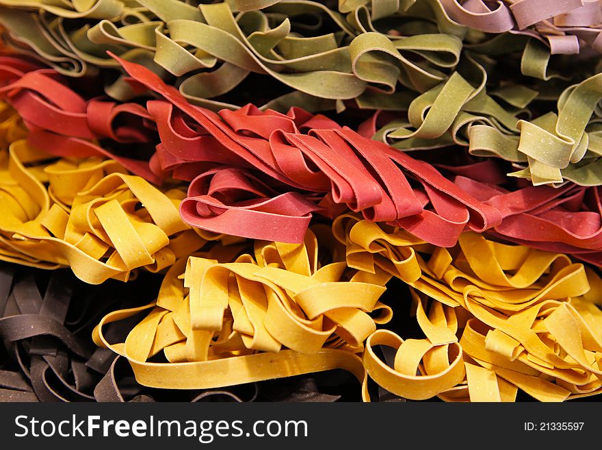 Colourful Italian pasta tagliatelle made from traditional recipe. Colourful Italian pasta tagliatelle made from traditional recipe