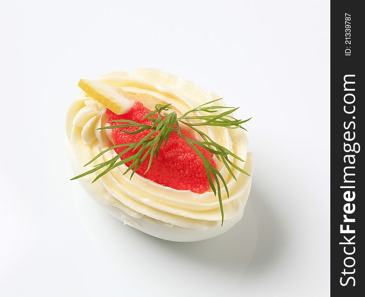 Egg white filled with creamy spread and caviar. Egg white filled with creamy spread and caviar