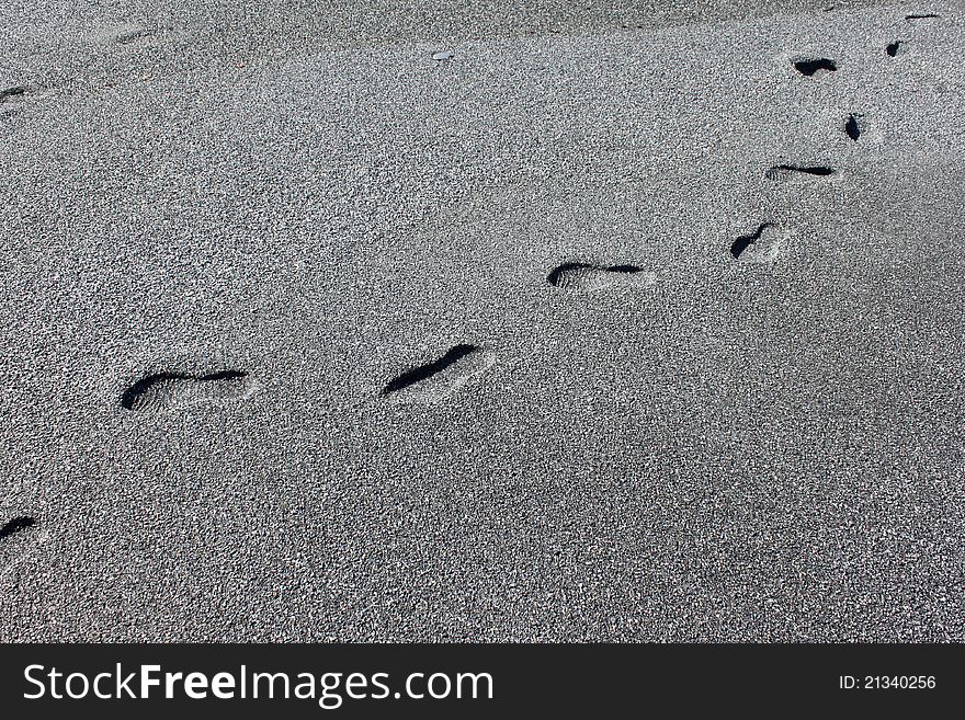 Adult footprints in the sand on the beach. Adult footprints in the sand on the beach