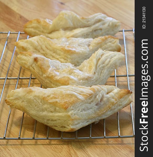 Fresh baked turnovers cooling on a cooling rack. Fresh baked turnovers cooling on a cooling rack