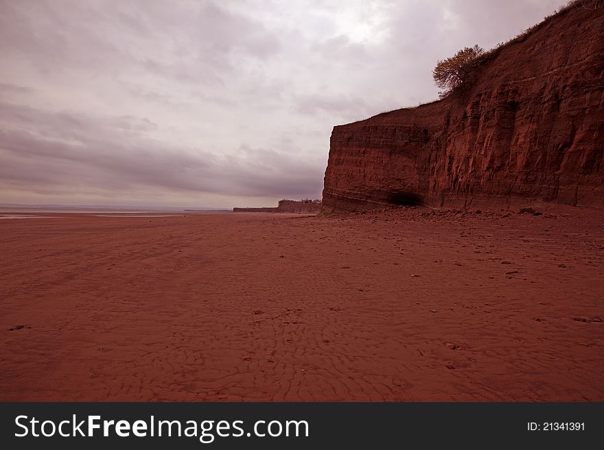 Large sandy beach heading to nothing among the rock cliffs. Large sandy beach heading to nothing among the rock cliffs