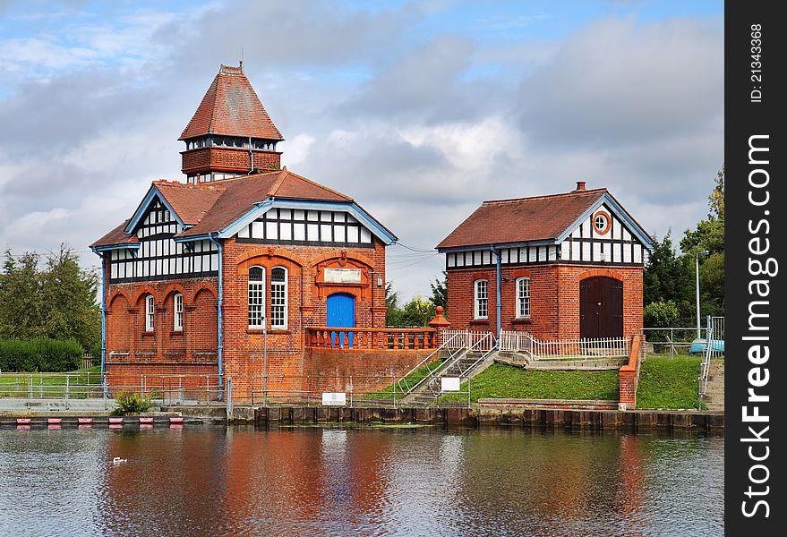 Red Brick water treatment building on the Banks of the River Thames in England. Red Brick water treatment building on the Banks of the River Thames in England