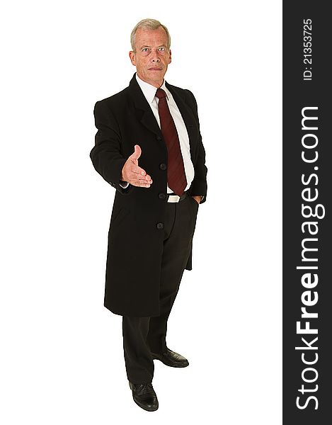 Business man in black suit holding hand out for greeting over a white background. Business man in black suit holding hand out for greeting over a white background