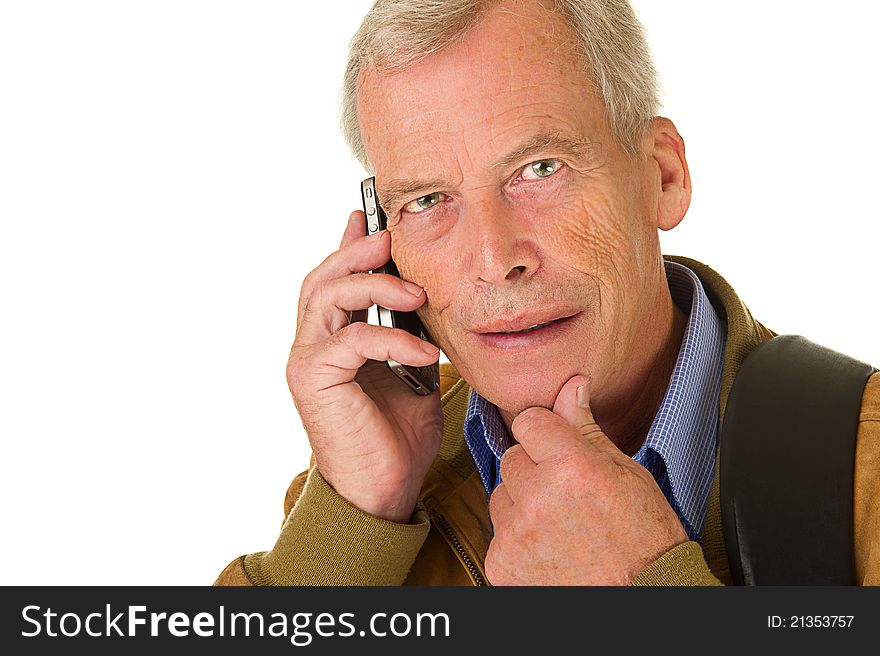 Close-up of business man in black suit talking on his mobil phone. Over a white background. Close-up of business man in black suit talking on his mobil phone. Over a white background