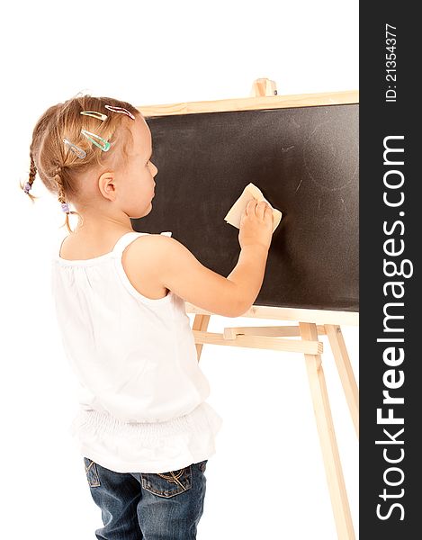 Little girl is standing at the blackboard in studio. Little girl is standing at the blackboard in studio