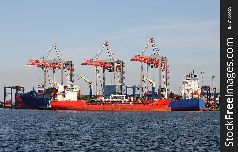 Trading seaport with cranes and cargo ships