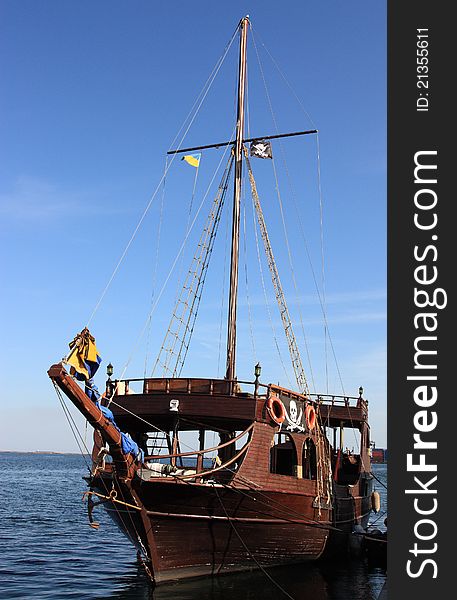 Old anchored wooden piratical frigate. Old anchored wooden piratical frigate