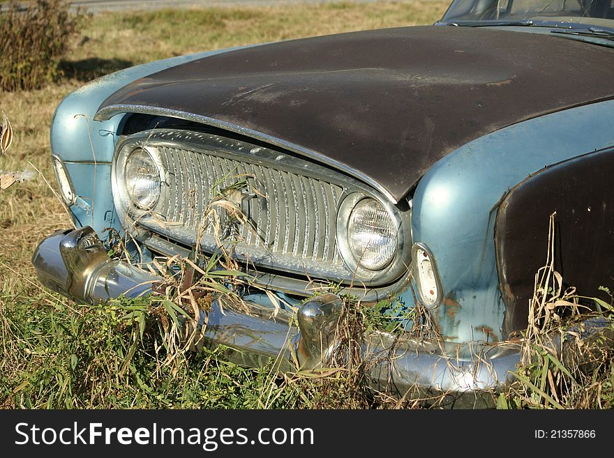 Vintage car abandonded in auto yard. Vintage car abandonded in auto yard