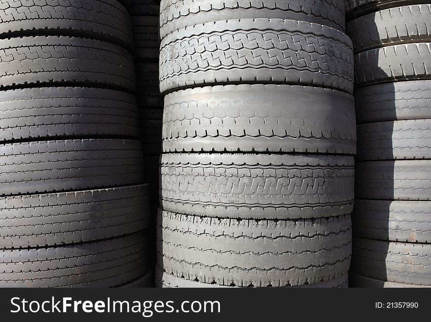 Pile of old car tires for rubber recycling