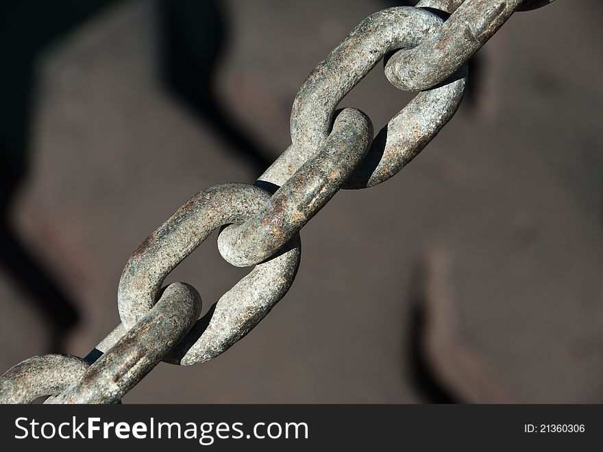 A close up on a chain and a tyre in the harbor, Cape Town, South Africa. A close up on a chain and a tyre in the harbor, Cape Town, South Africa