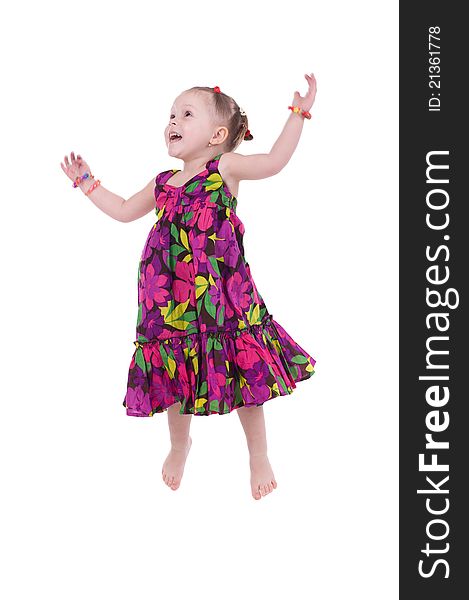 Little girl jumps on a white background