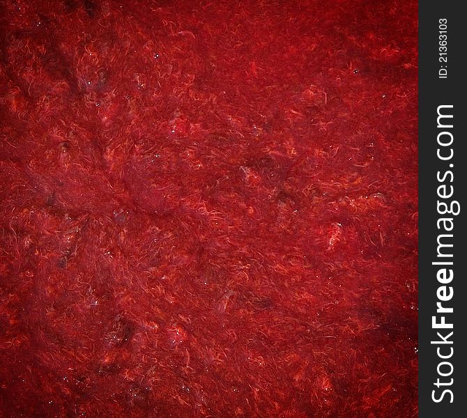 Red grunge texture of plum jam