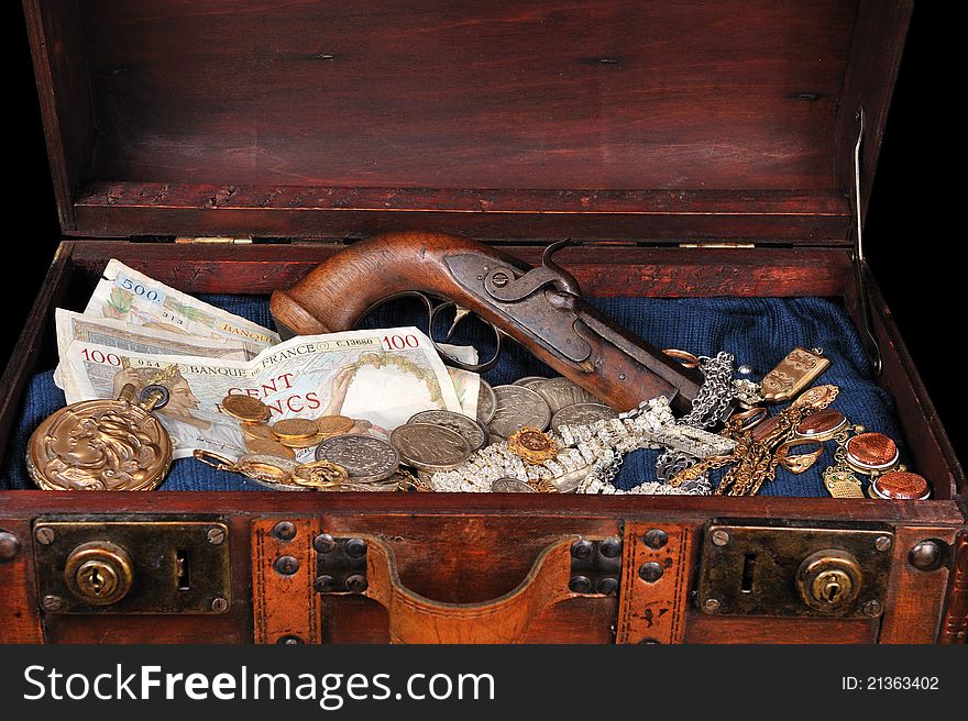 A trunk full of coins and precious jewelry. A trunk full of coins and precious jewelry