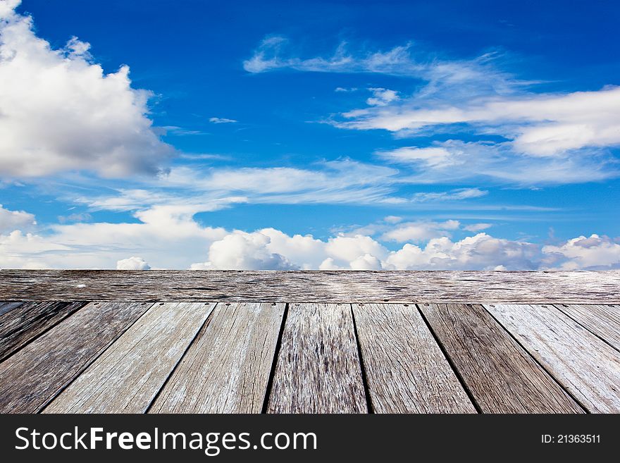Wooden balcony in the blue sky background. Wooden balcony in the blue sky background