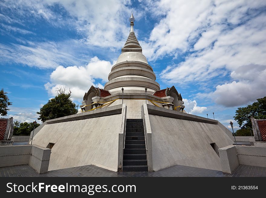 White pagoda in Wat Phra That Pha Ngao on blue sky background