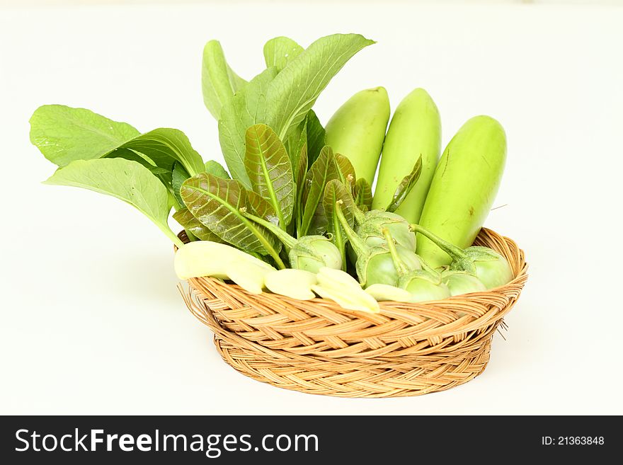 A basket of fresh vegetable on white background