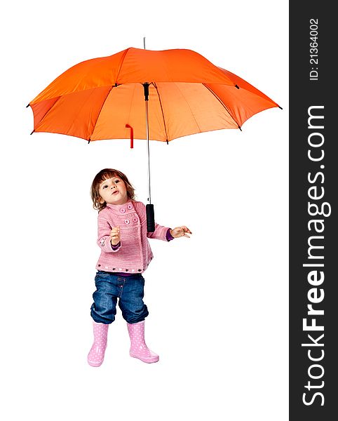 Little girl with an orange umbrella in the studio on a white background