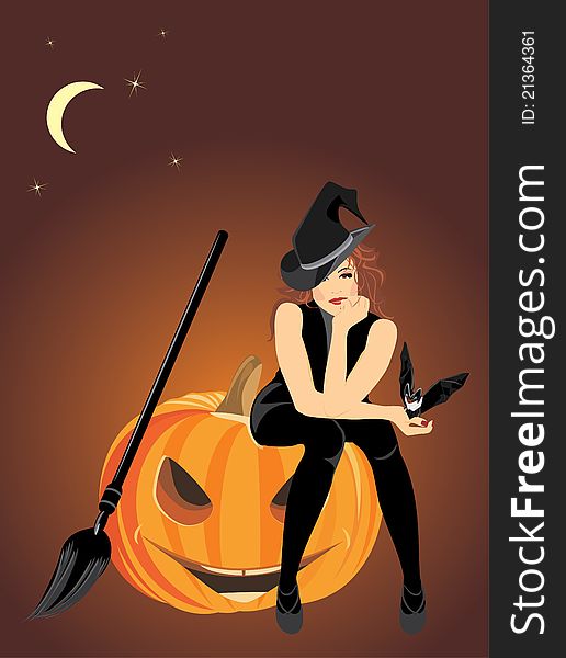 Sitting witch on the halloween pumpkin