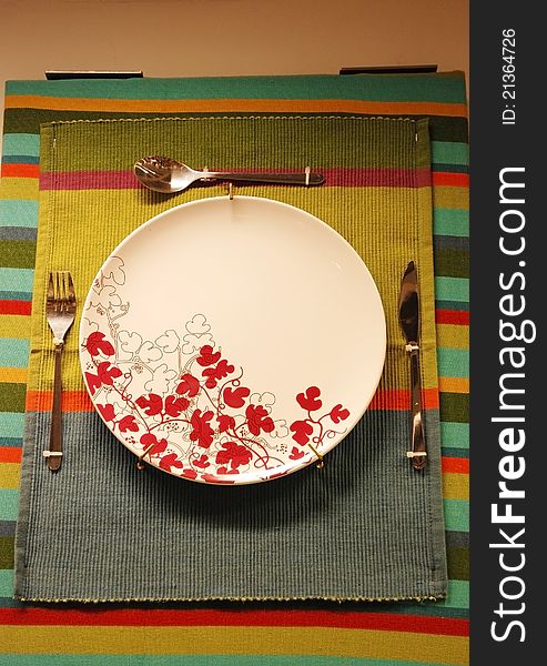 White plate on the cloth for sale with knife,fork,and spoon. White plate on the cloth for sale with knife,fork,and spoon.
