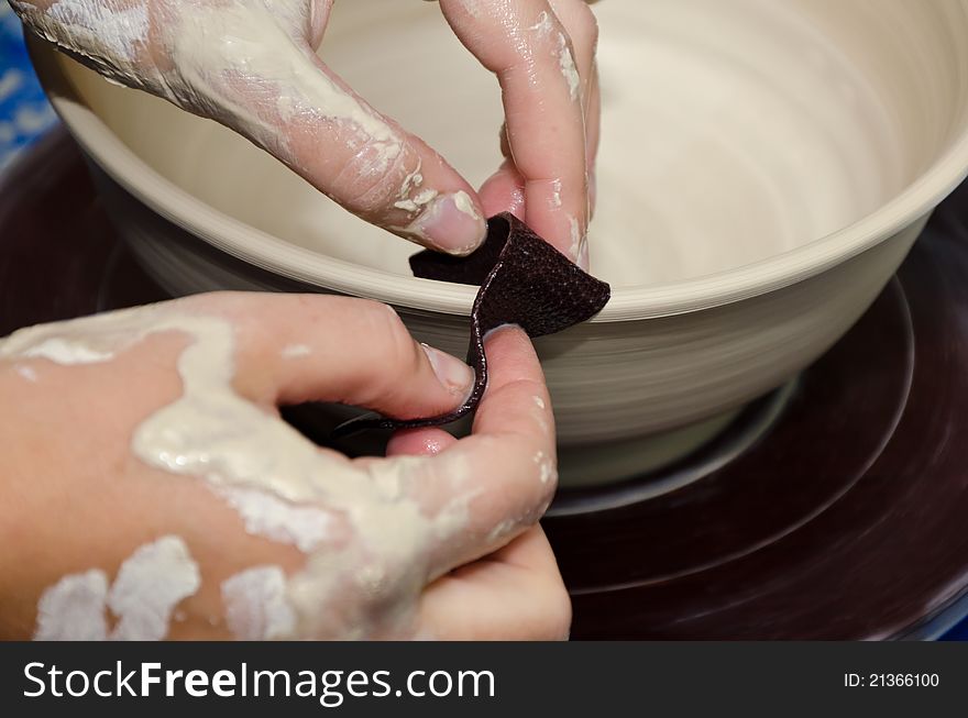 The process of creating pottery by hand. The process of creating pottery by hand
