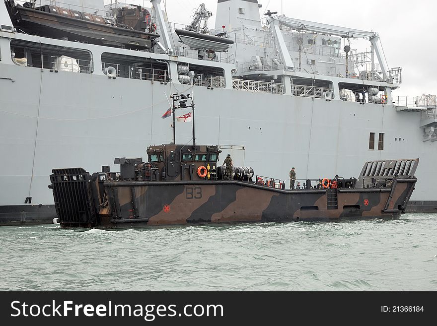 An LCU Mk10 landing craft of the Marine Landing Craft Unit, 4 Assault Squadron Royal Marines, alongside HMS Bulwark. An LCU Mk10 landing craft of the Marine Landing Craft Unit, 4 Assault Squadron Royal Marines, alongside HMS Bulwark.