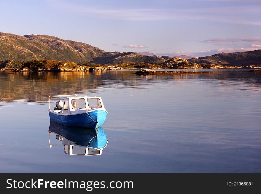 Fishing boat in late afternoon sun, in the northern Norwegian fjords. Fishing boat in late afternoon sun, in the northern Norwegian fjords