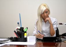 Girl Sitting At Desk Stock Images