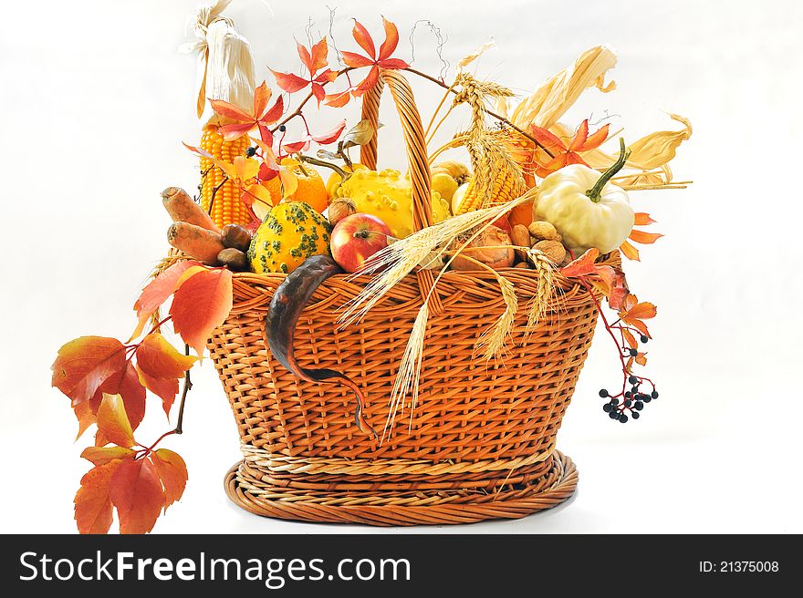 Autumnal basket over white background