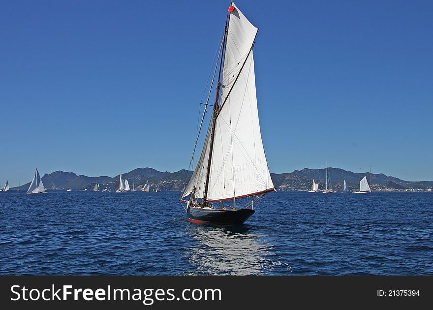 Vintage yacht at sea regatta royal cannes rear view