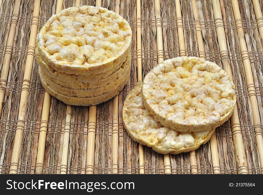 Round corn cakes over rustic surface