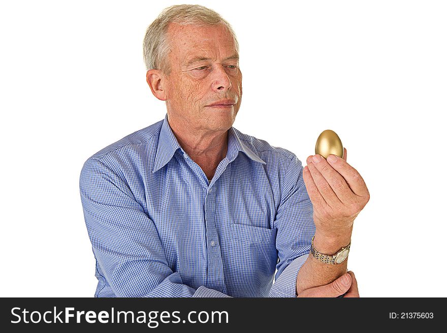 Senior man with his golden egg. His fortune/savings. Pleasent age. Senior man with his golden egg. His fortune/savings. Pleasent age.