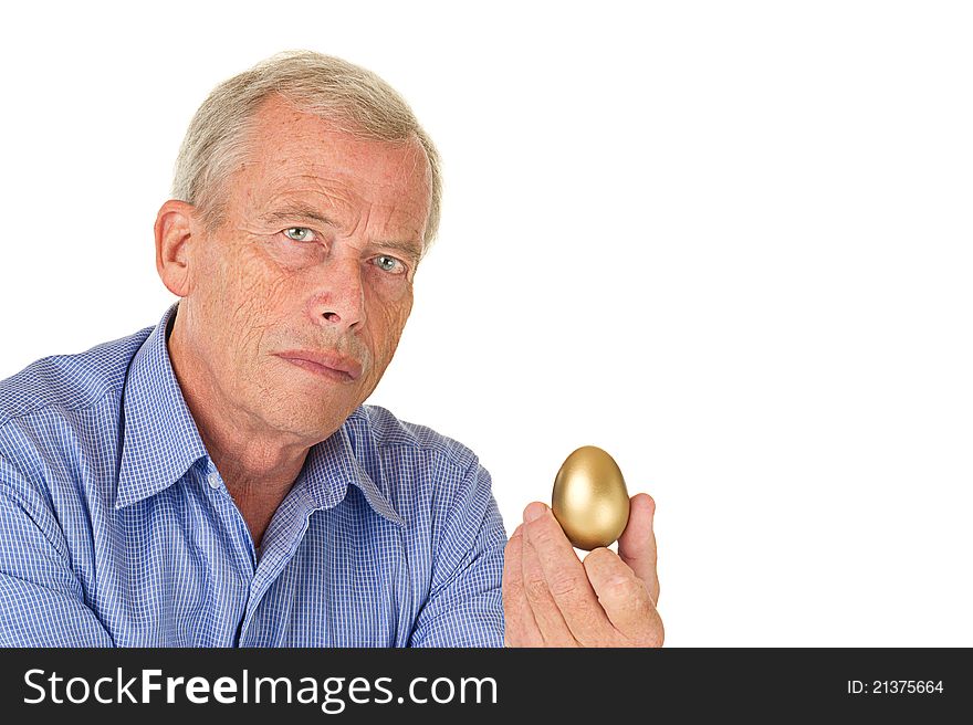 Senior man with golden egg