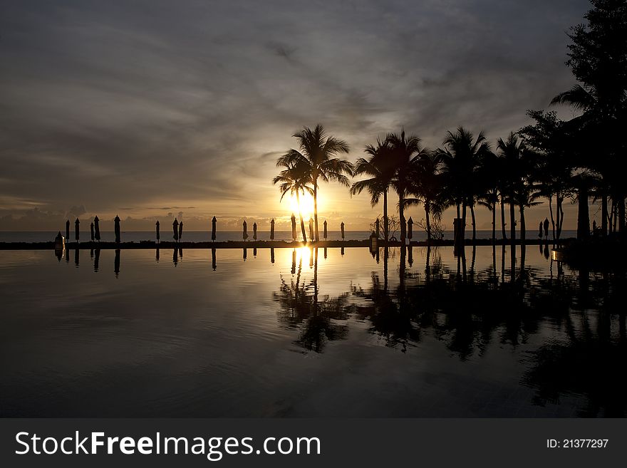 Pool and sea in the morning sunset , beach of Thailand. Pool and sea in the morning sunset , beach of Thailand