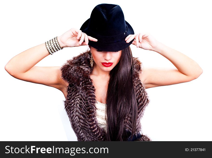 Woman fashion model posing with a hat on a white background. Woman fashion model posing with a hat on a white background