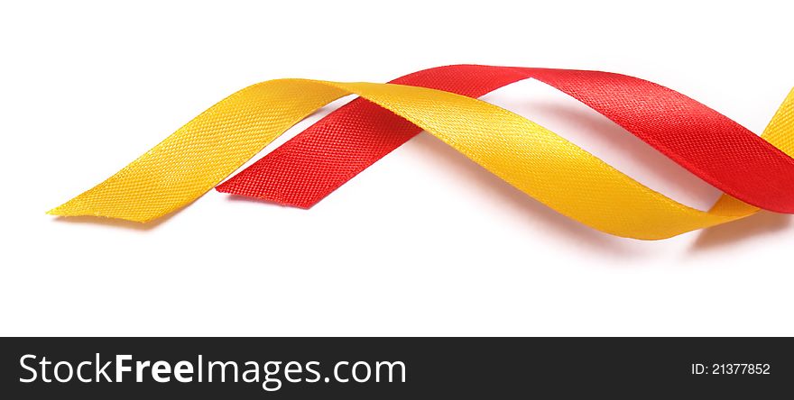 Red and yellow ribbons on white background